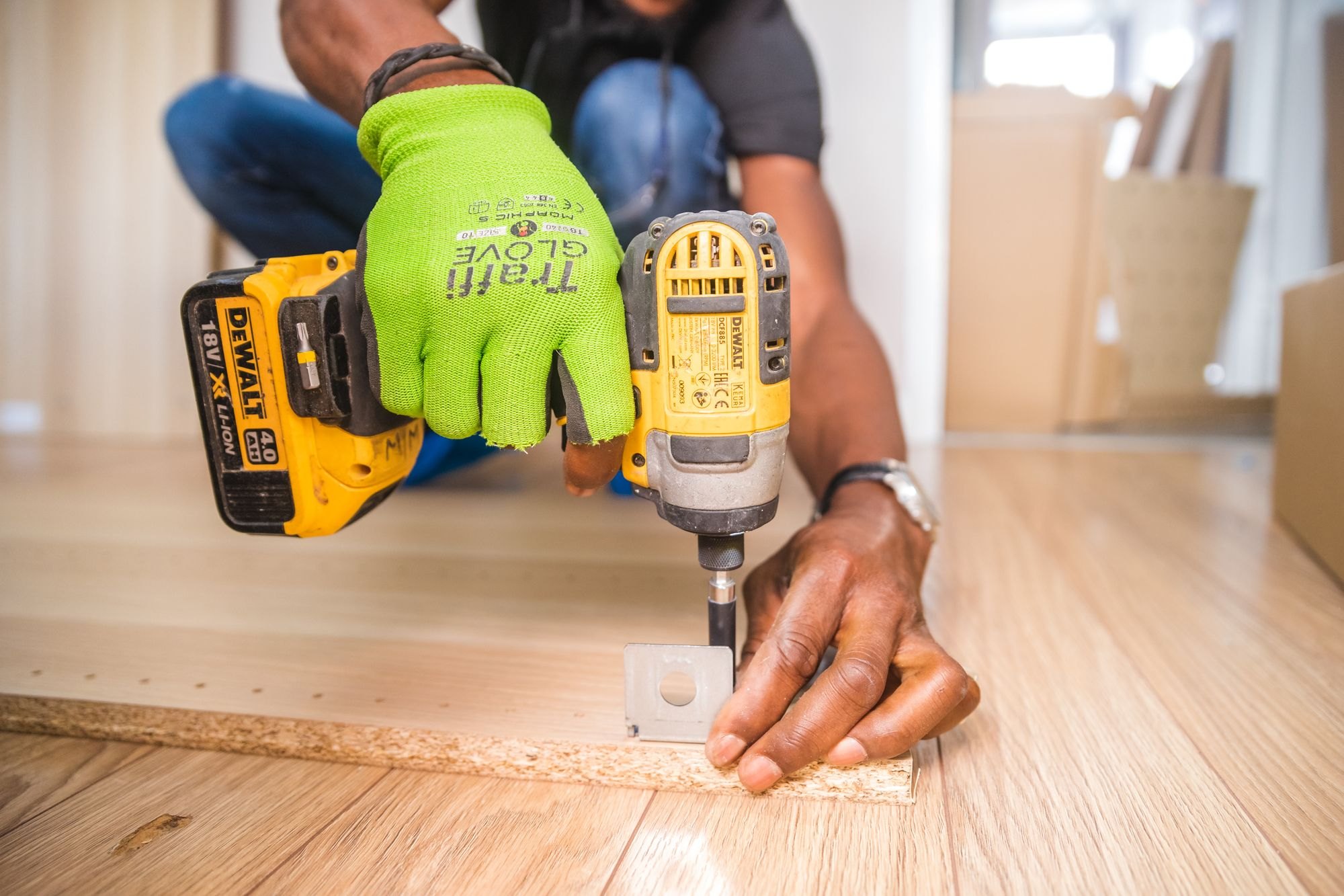 Carpenter driving fasteners with an impact driver