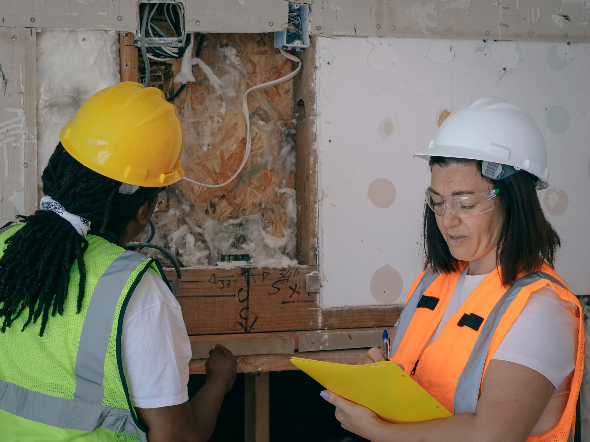 Trades crew reviewing work on an active site