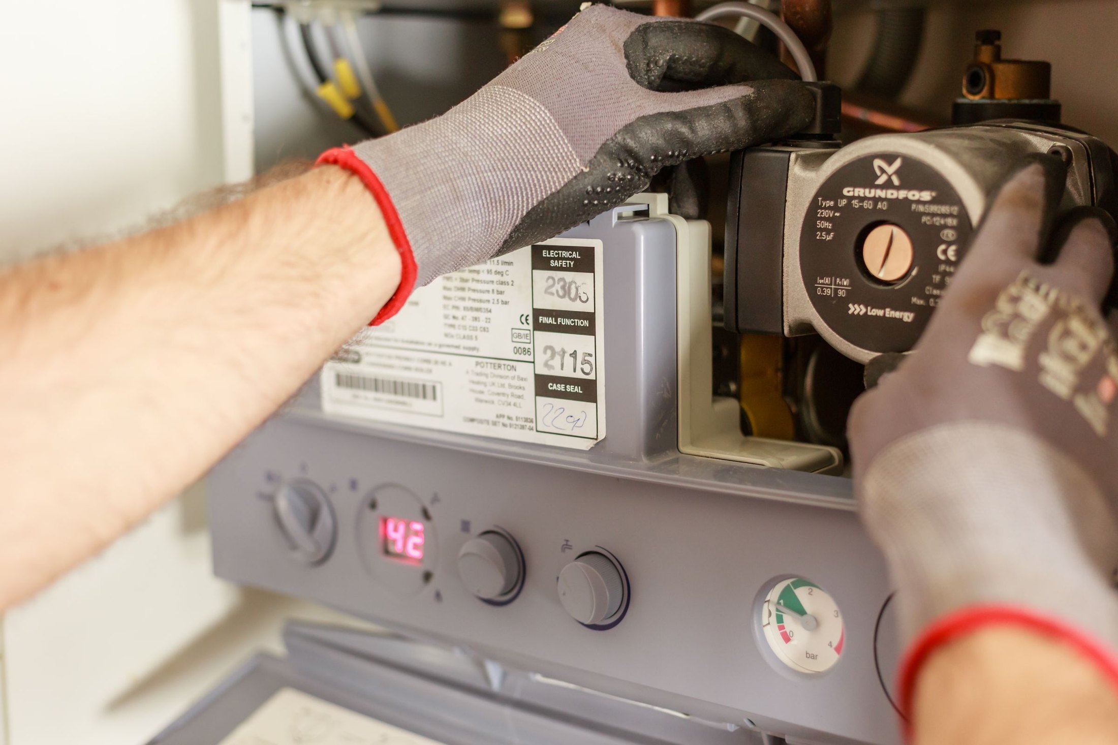Technician servicing a residential boiler