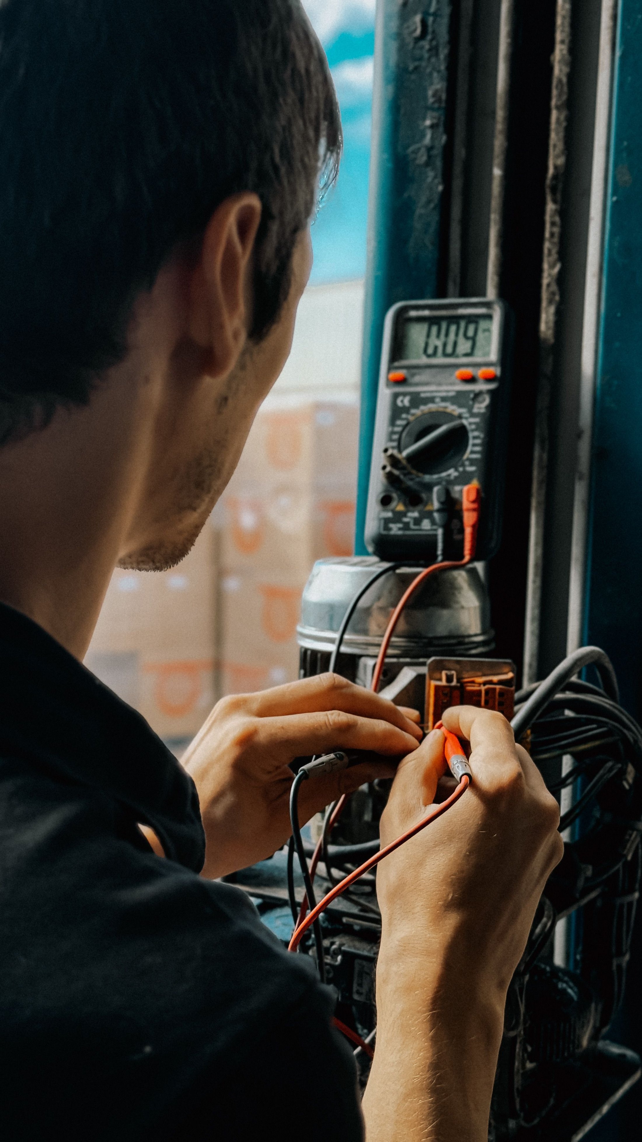Technician testing mechanical equipment