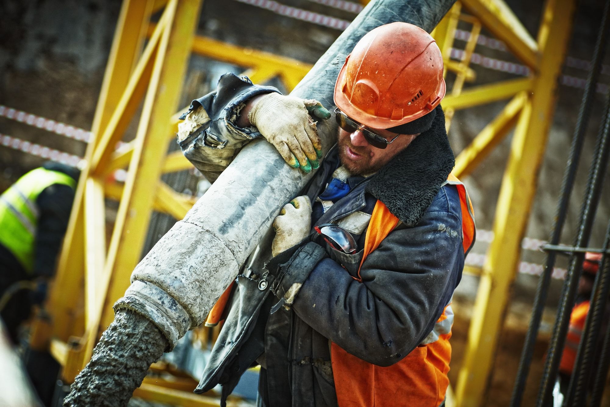 Crew pouring concrete on a construction site
