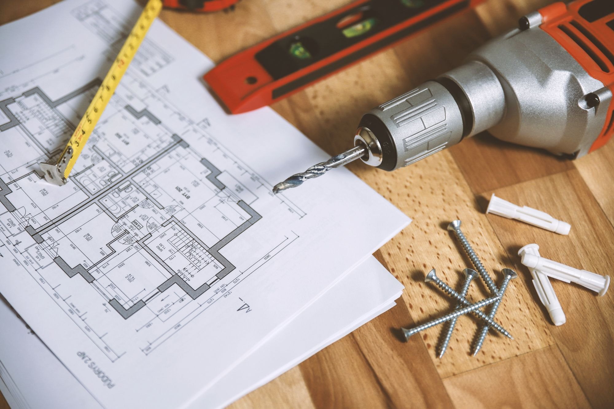Tools and floor plans laid out for a job